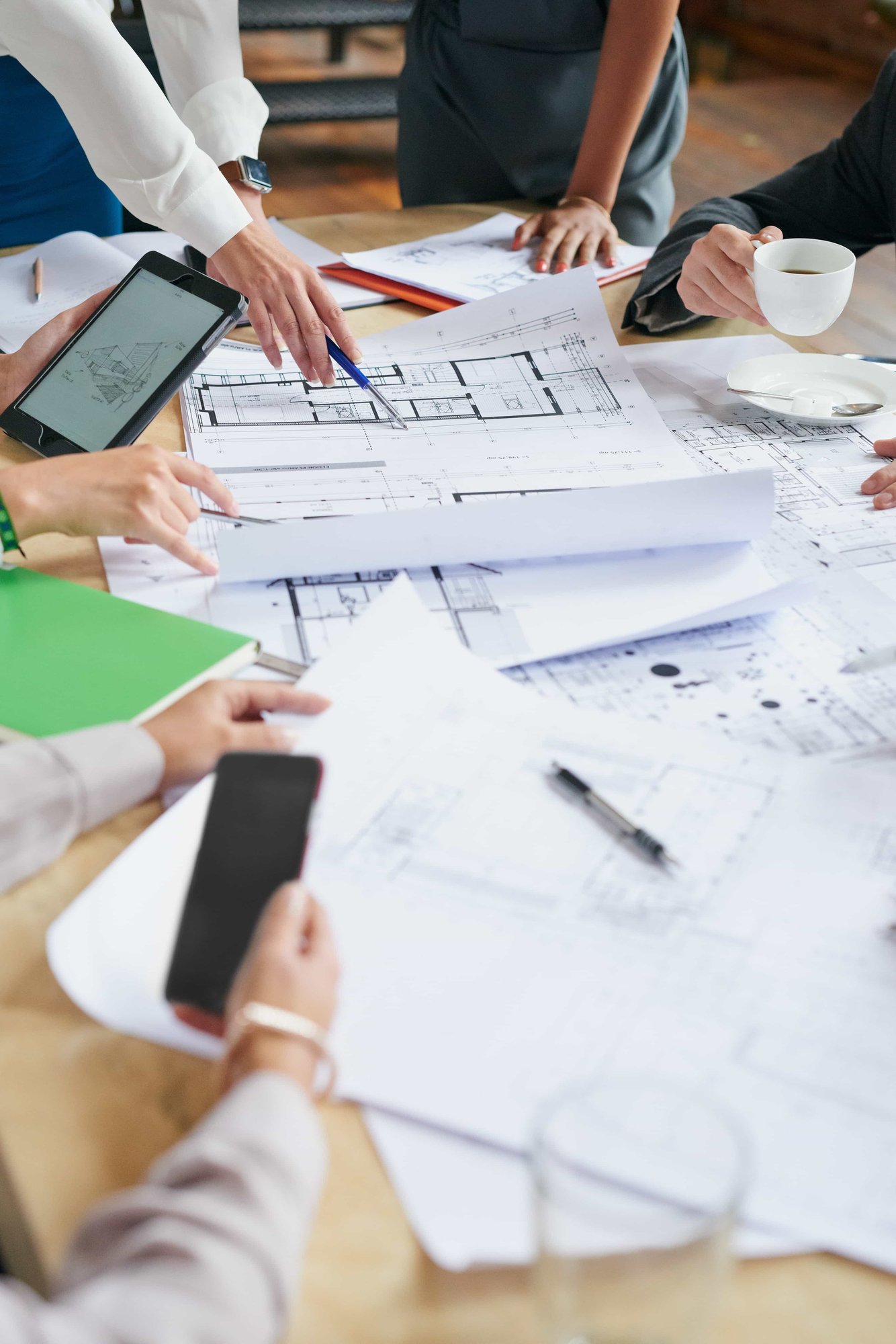 blueprint and hands of business people in office_1015272612