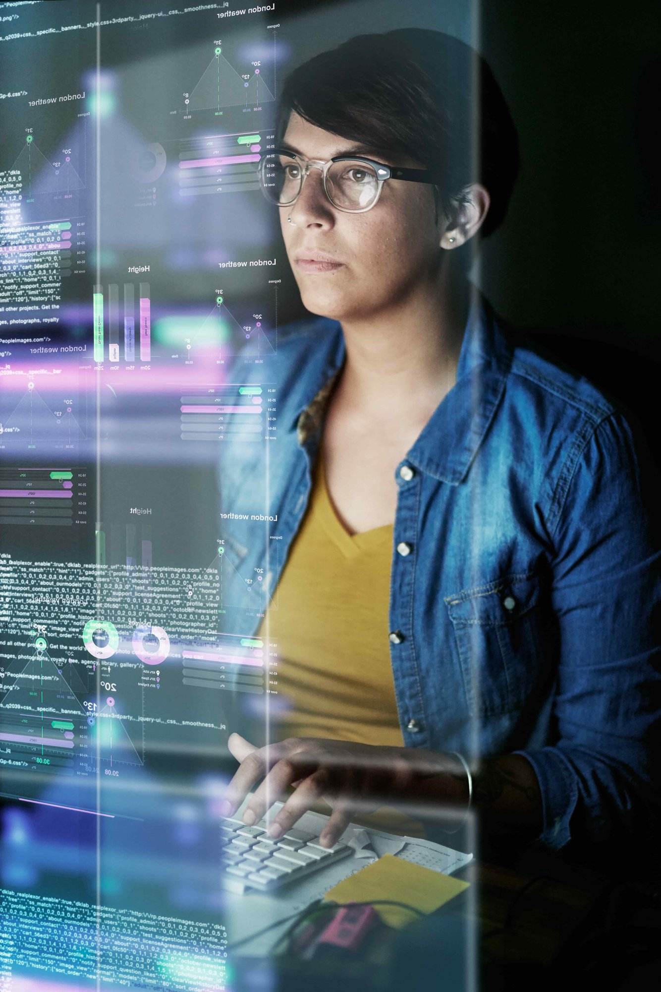 young computer programmer looking through data_481289664