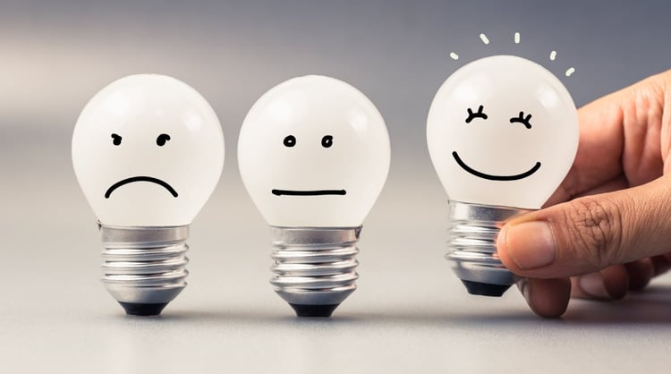 feedback light bulbs making a sad, neutral, and happy face