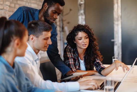 young-team-looking-at-laptop-1-1