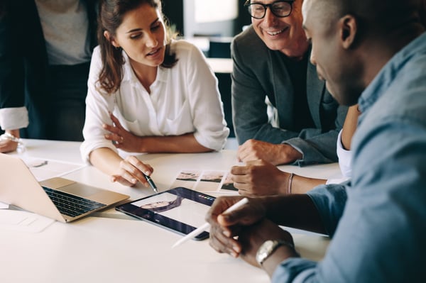 Employees discussing a marketing campaign_336027920