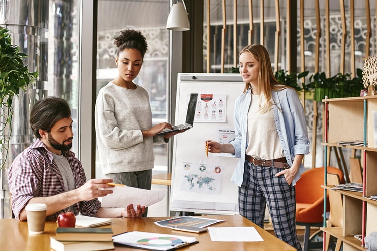 marketing agency employees reviewing reports