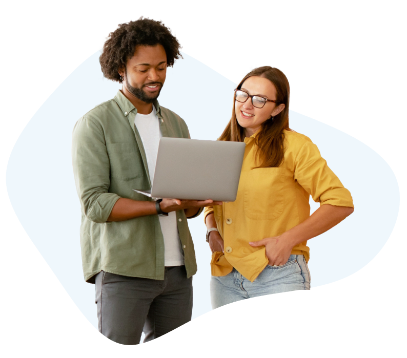 coworkers reviewing paid media results on a laptop