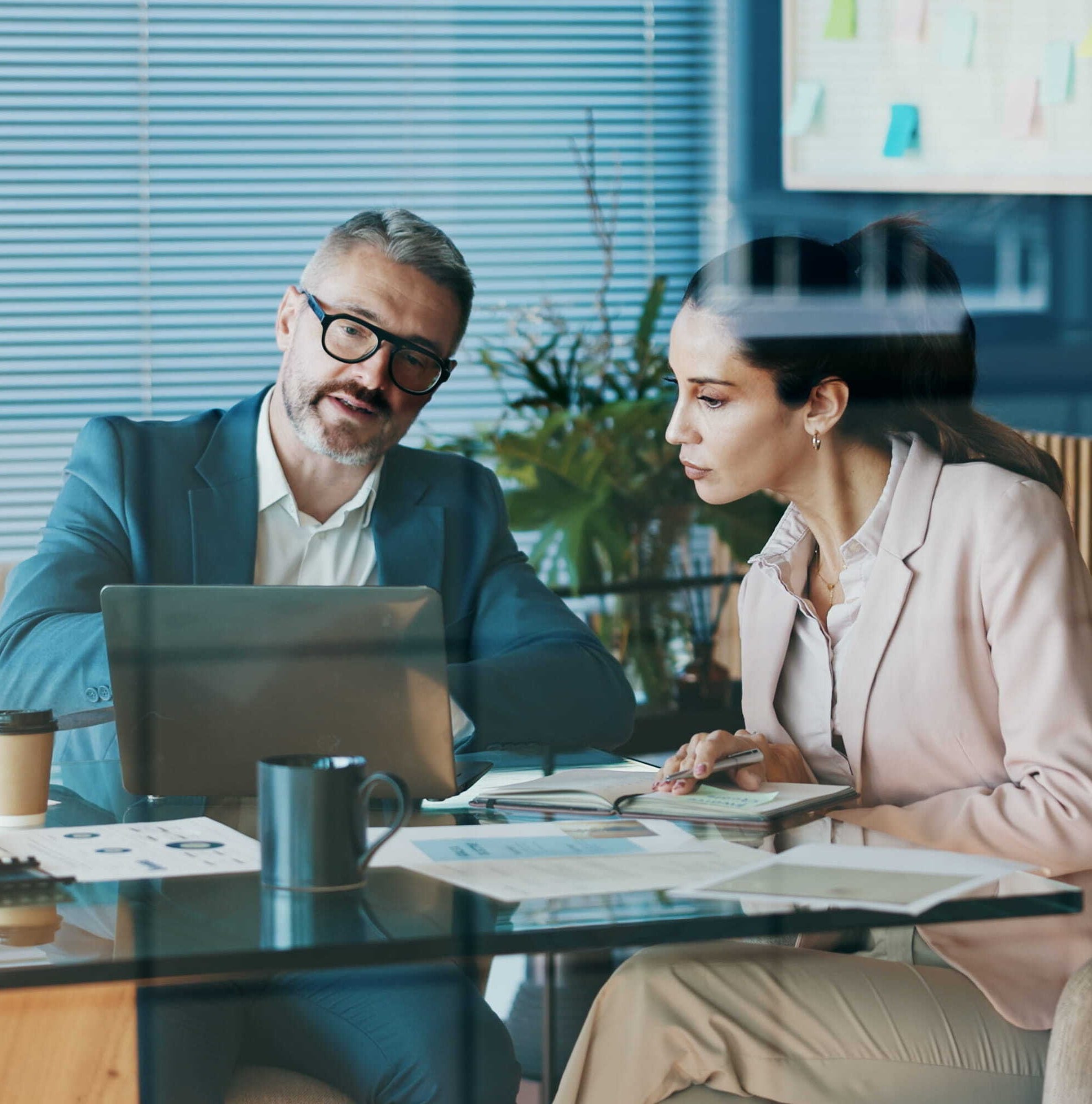 business people in office with discussion for company investment deal_1484904977